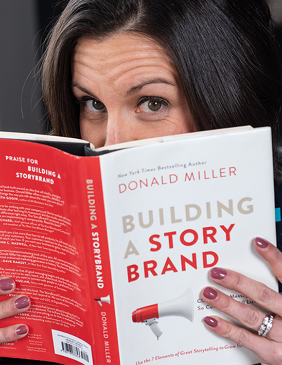Julie Biddle with the Building a Story Brand book.