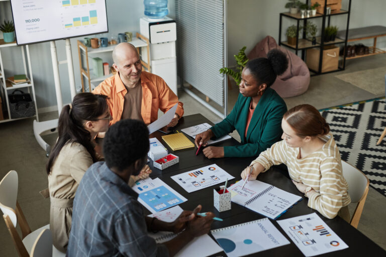 A group of business people gathering at a table